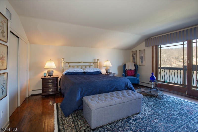 5 Marine Terrace Sparta, NJ 07871 - Photo 6 of 48 a bedroom with a bed and wooden floor