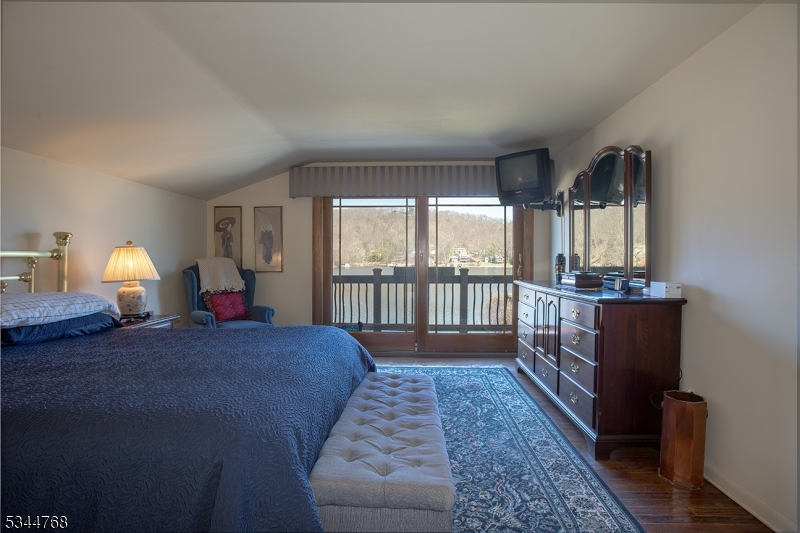 5 Marine Terrace Sparta, NJ 07871 - Photo 7 of 48 a bed room with a bed and a large window