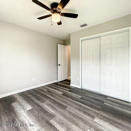 2950 Lakeside Villa Road Orange Park, FL 32073 - Photo 12 of 44 a view of empty room with wooden floor and fan