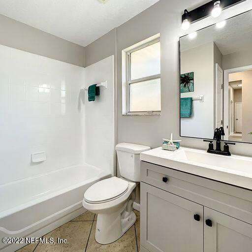 2950 Lakeside Villa Road Orange Park, FL 32073 - Photo 13 of 44 a bathroom with a sink a toilet and shower
