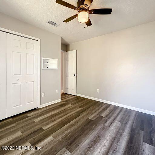 2950 Lakeside Villa Road Orange Park, FL 32073 - Photo 15 of 44 a view of empty room with wooden floor