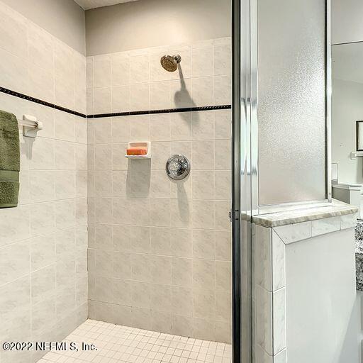 2950 Lakeside Villa Road Orange Park, FL 32073 - Photo 17 of 44 a bathroom with a shower and a sink