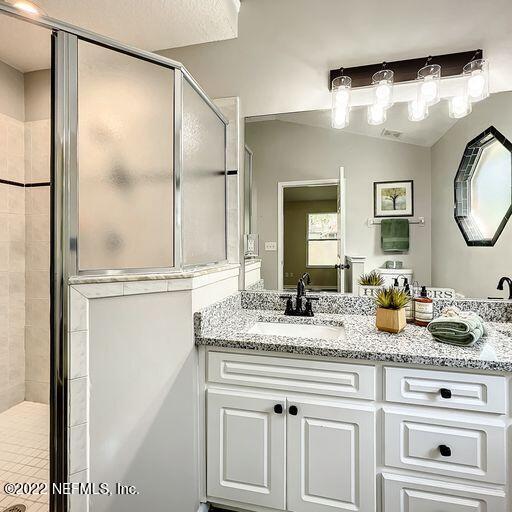 2950 Lakeside Villa Road Orange Park, FL 32073 - Photo 19 of 44 a bathroom with a granite countertop sink and a mirror