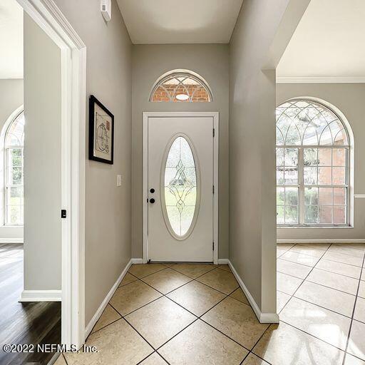 2950 Lakeside Villa Road Orange Park, FL 32073 - Photo 37 of 44 a view of an entryway with wooden floor and a window