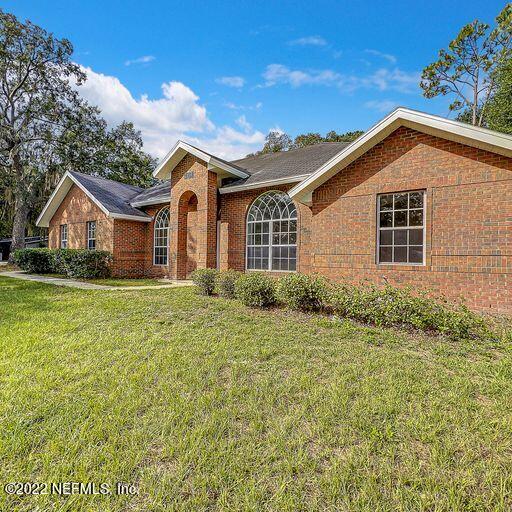 2950 Lakeside Villa Road Orange Park, FL 32073 - Photo 40 of 44 a front view of a house with a yard