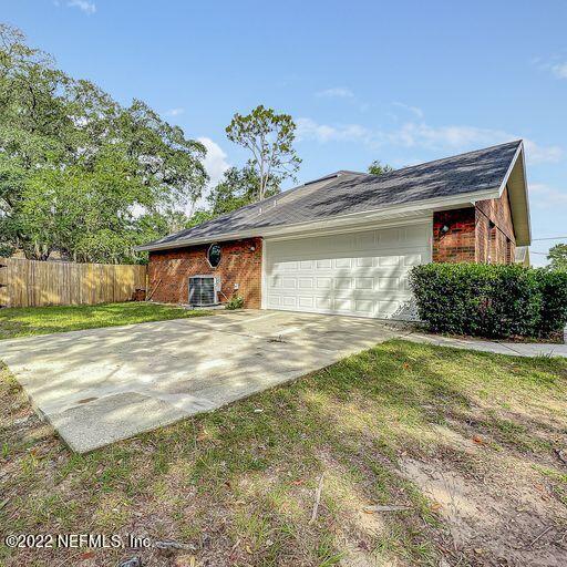 2950 Lakeside Villa Road Orange Park, FL 32073 - Photo 41 of 44 a front view of a house with a yard