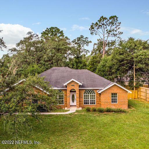 2950 Lakeside Villa Road Orange Park, FL 32073 - Photo 42 of 44 a view of a house with a yard