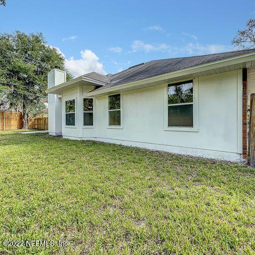 2950 Lakeside Villa Road Orange Park, FL 32073 - Photo 6 of 44 a front view of a house with garden