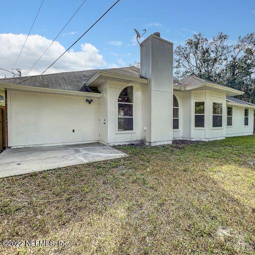 2950 Lakeside Villa Road Orange Park, FL 32073 - Photo 7 of 44 a front view of a house with garden