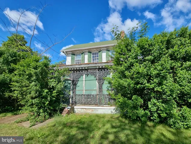 front view of a house with a garden