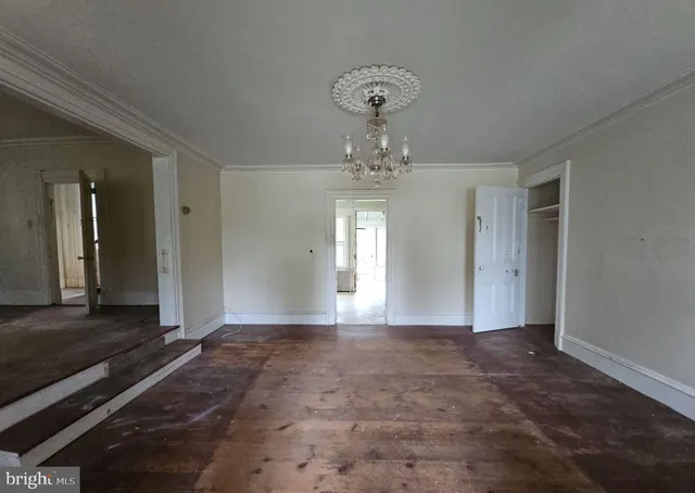 a view of a chandelier and window in a room