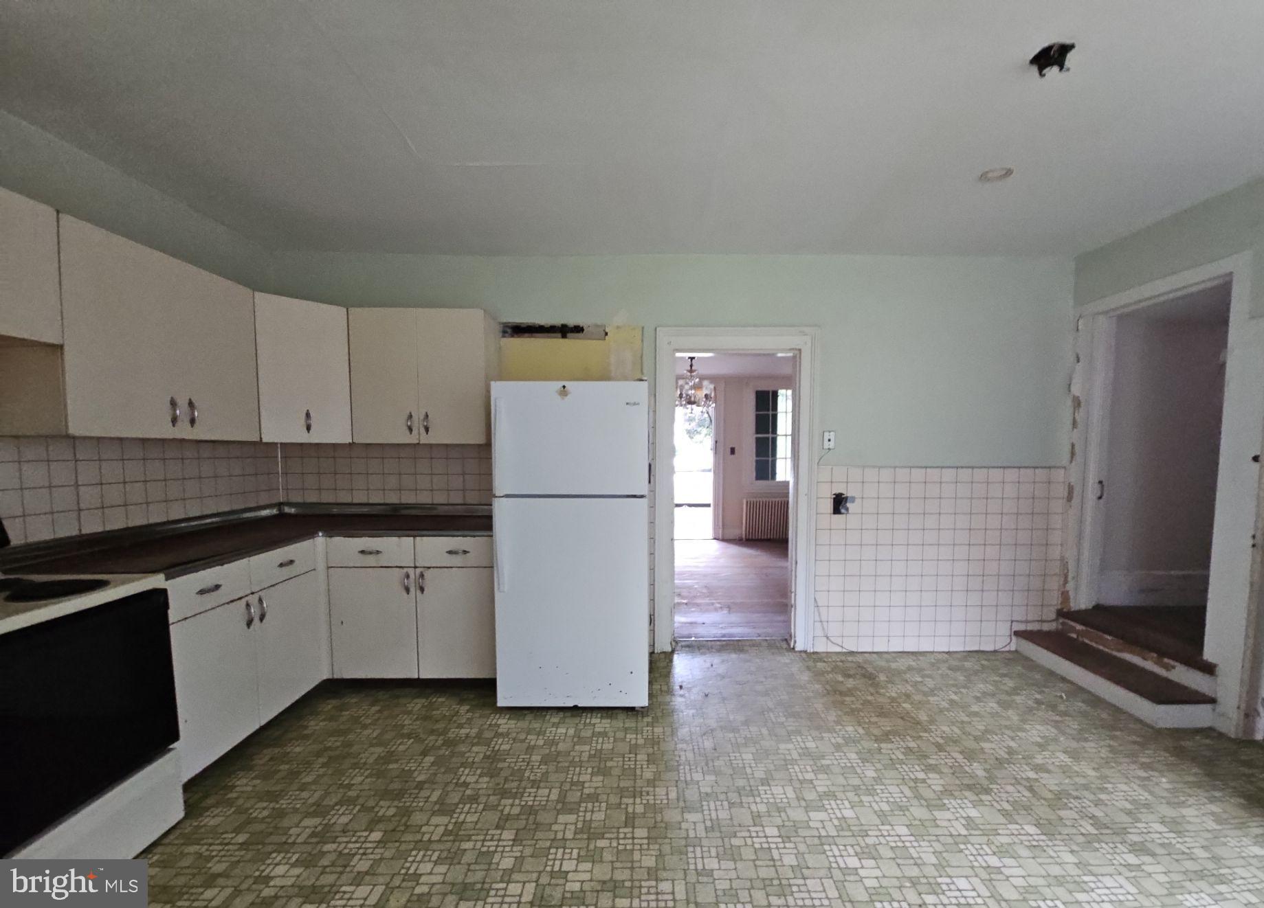 1223 Front Street Mauricetown, NJ 08329 - Photo 9 of 17 a kitchen with cabinets and white appliances