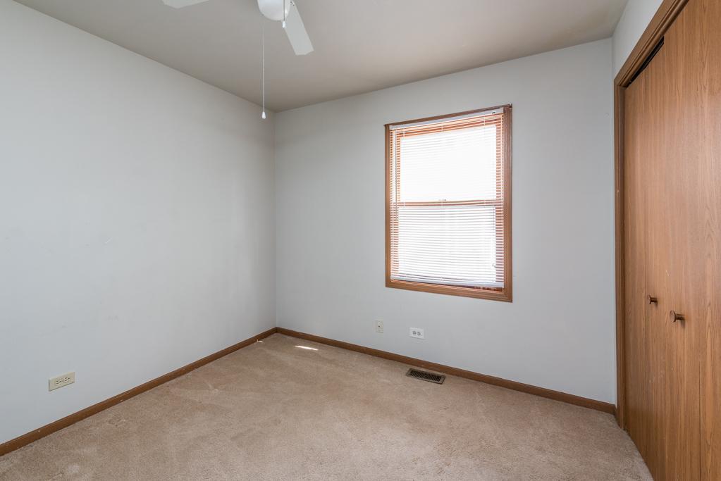 1702 Hebron Avenue Zion, IL 60099 - Photo 14 of 28 an empty room with a window