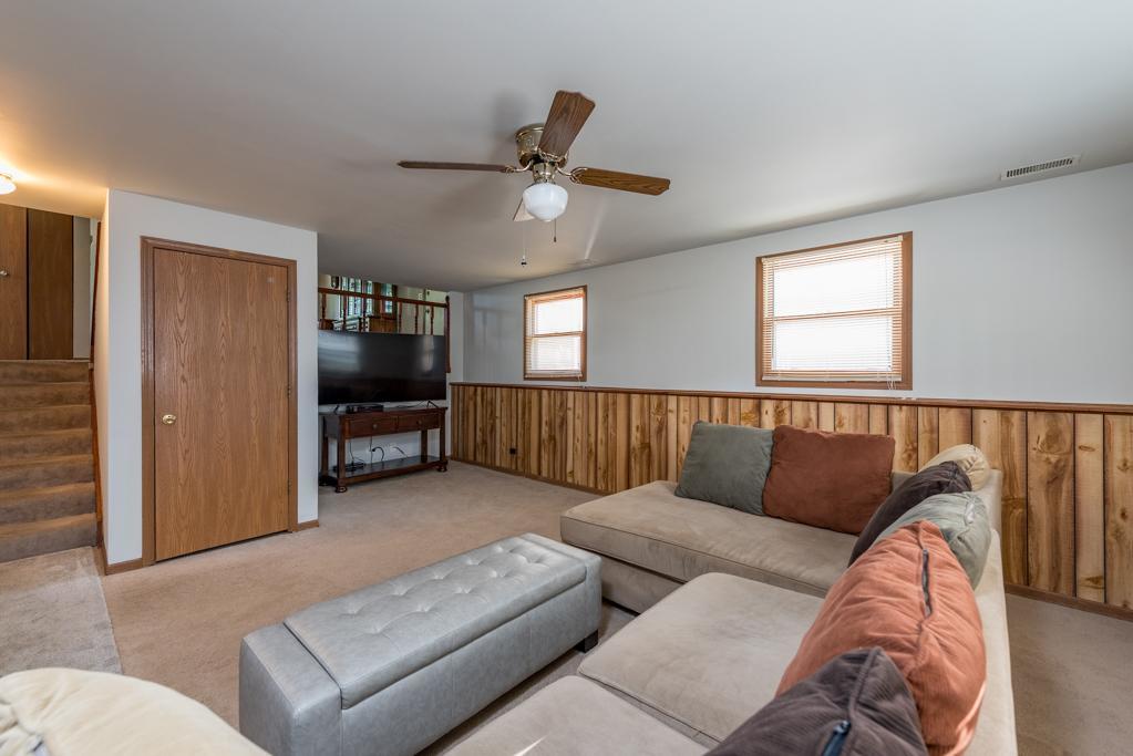 1702 Hebron Avenue Zion, IL 60099 - Photo 17 of 28 a living room with furniture and a flat screen tv