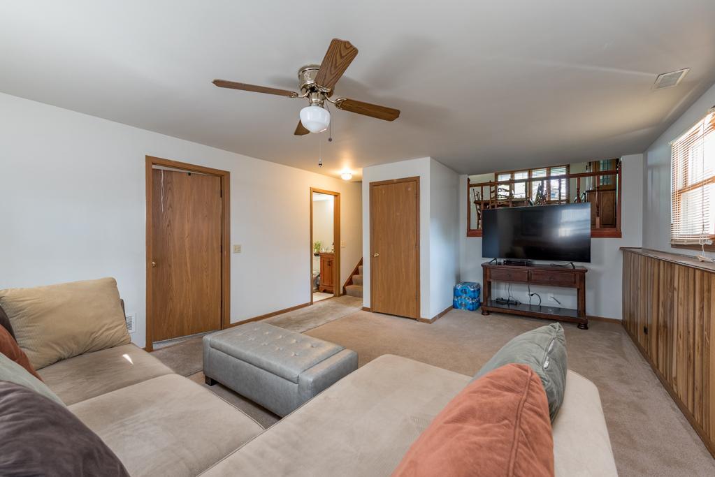 1702 Hebron Avenue Zion, IL 60099 - Photo 18 of 28 a living room with furniture and a flat screen tv