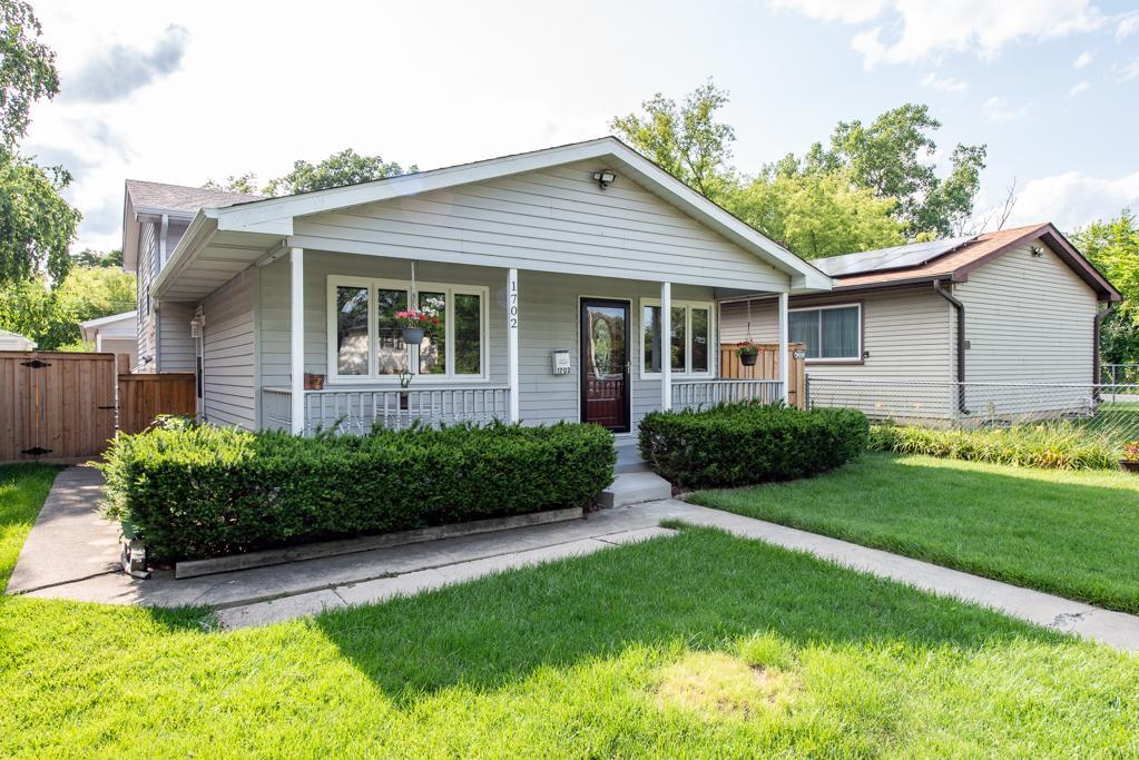1702 Hebron Avenue Zion, IL 60099 - Photo 2 of 28 a front view of a house with a yard