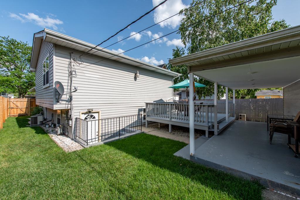 1702 Hebron Avenue Zion, IL 60099 - Photo 22 of 28 a view of a backyard with plants and a patio