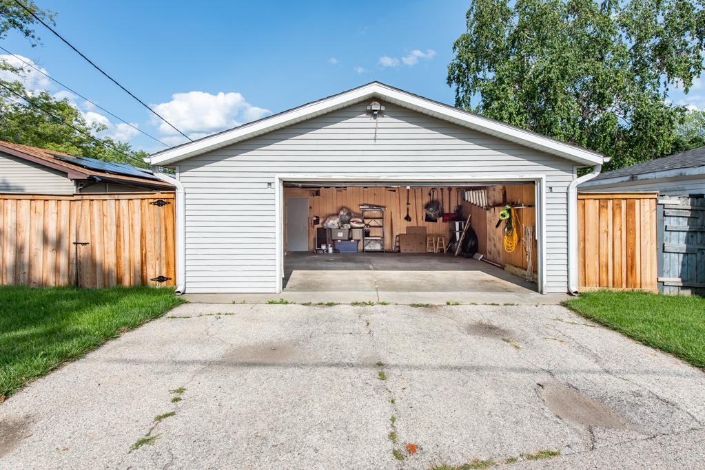 1702 Hebron Avenue Zion, IL 60099 - Photo 28 of 28 a front view of a house with garden