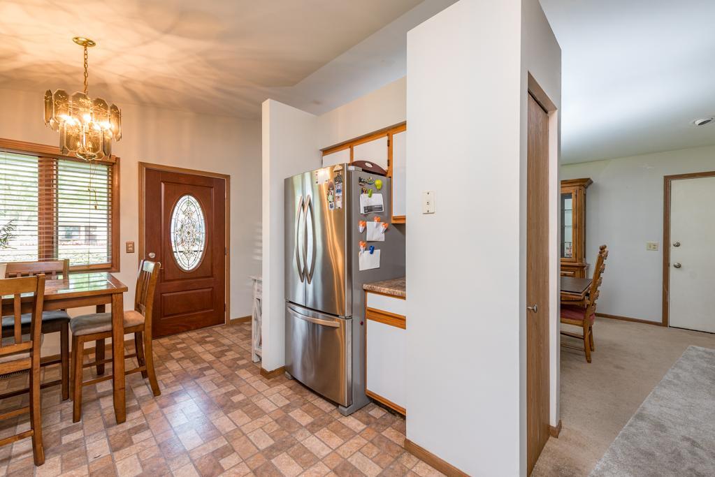 1702 Hebron Avenue Zion, IL 60099 - Photo 8 of 28 a view of a hallway with furniture and a chandelier
