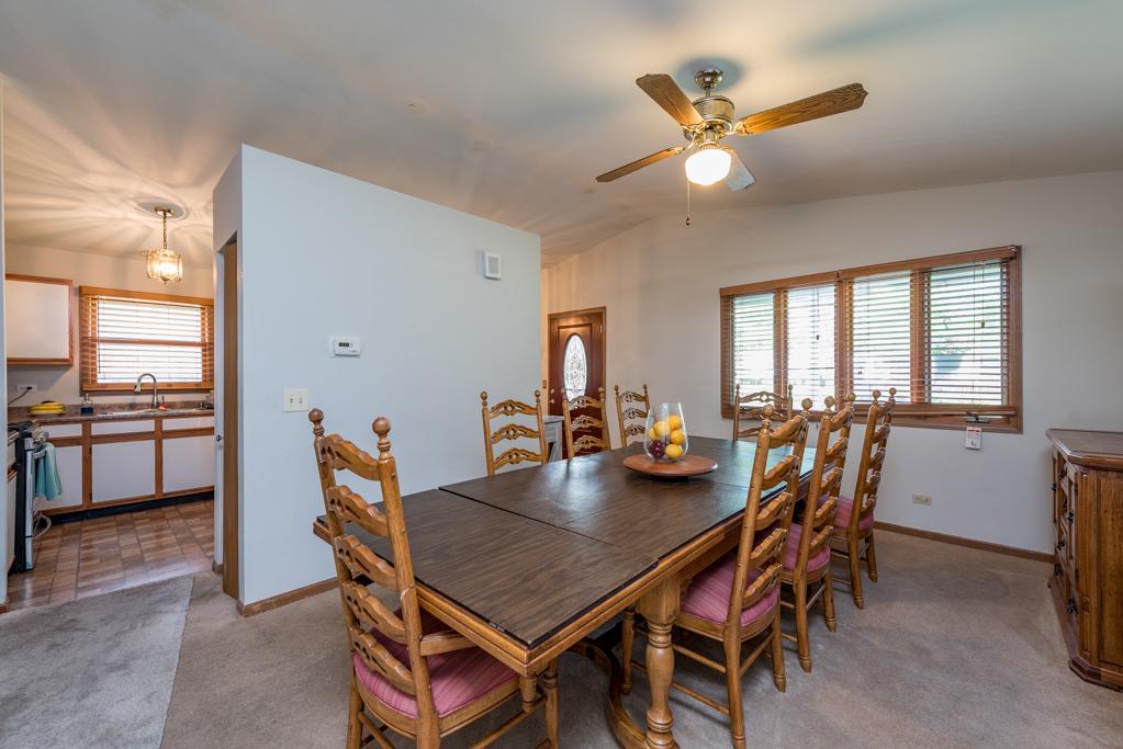 1702 Hebron Avenue Zion, IL 60099 - Photo 9 of 28 a dining room with furniture and window