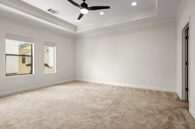 a bathroom with a bathtub shower sink vanity mirror and toilet