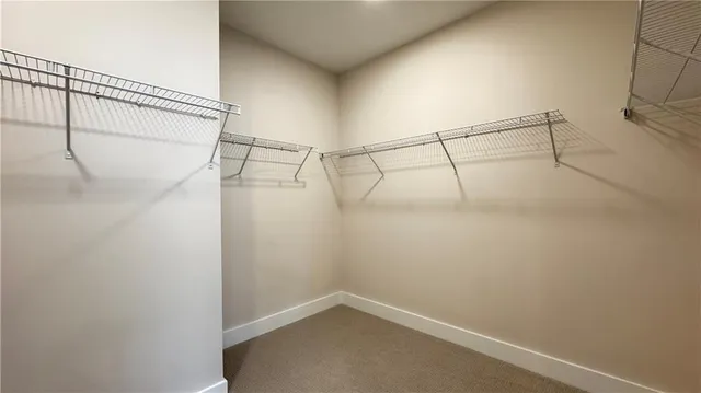 a bathroom with a shower sink and mirror