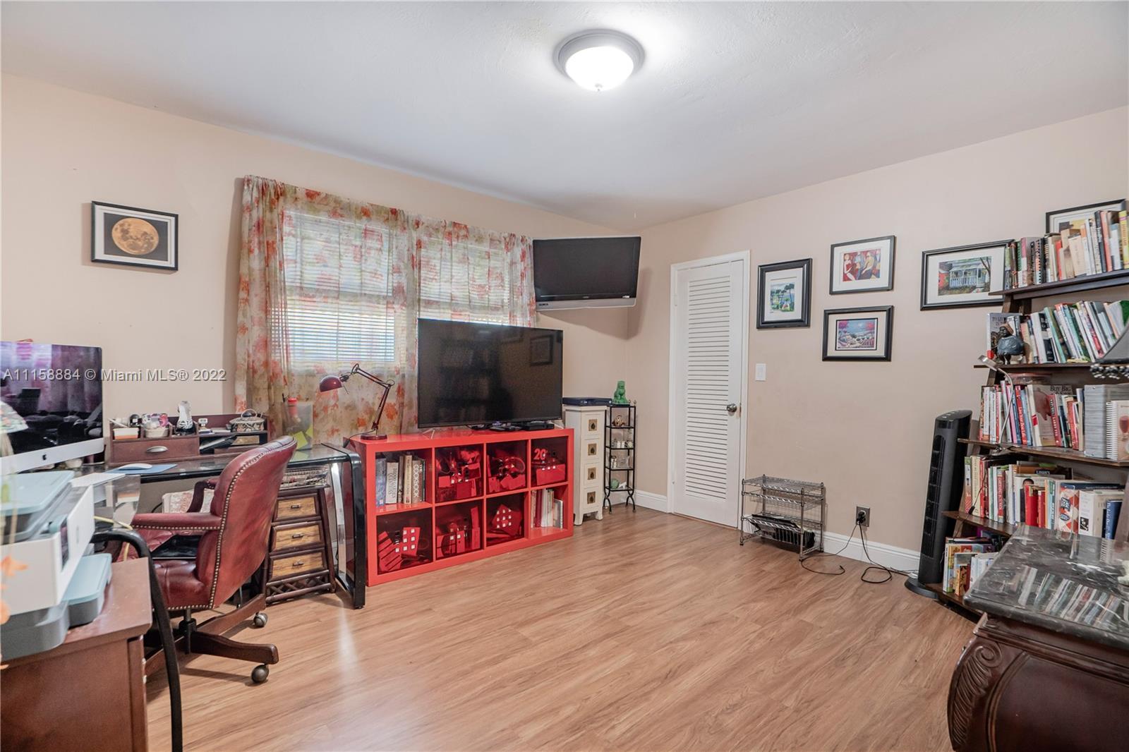 5012 Hayes Street Hollywood, FL 33021 - Photo 18 of 36 a view of a livingroom with furniture and a flat screen tv