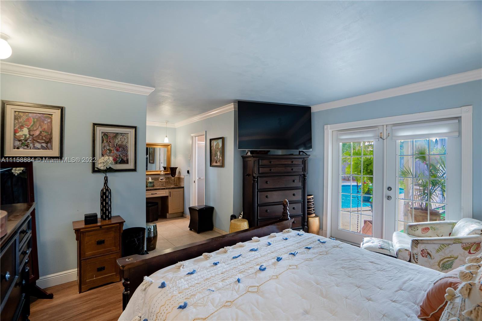 5012 Hayes Street Hollywood, FL 33021 - Photo 20 of 36 a bedroom with a bed and a television