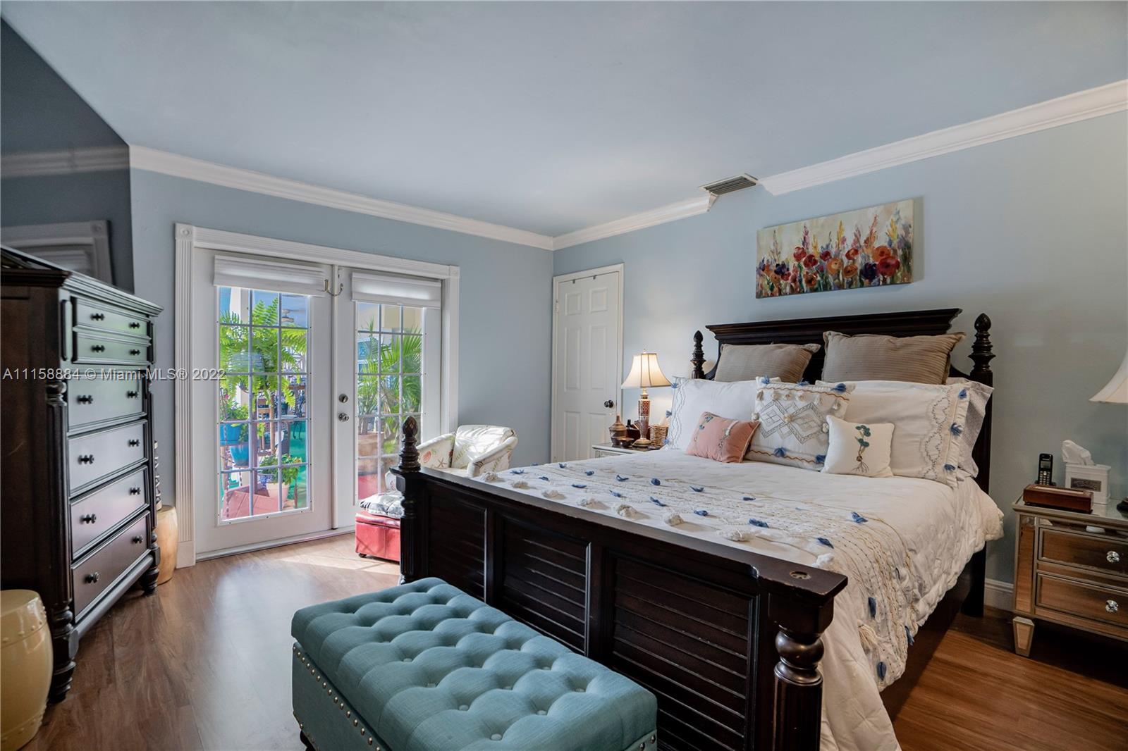 5012 Hayes Street Hollywood, FL 33021 - Photo 21 of 36 a bedroom with a bed and a dresser