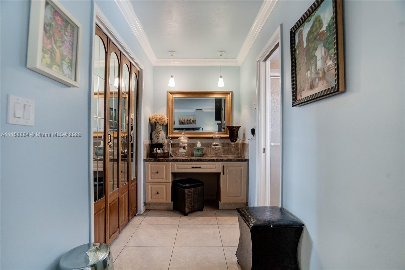 5012 Hayes Street Hollywood, FL 33021 - Photo 23 of 36 a kitchen with stainless steel appliances granite countertop a stove and a refrigerator