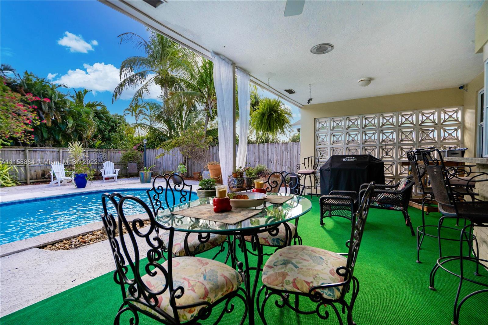 5012 Hayes Street Hollywood, FL 33021 - Photo 26 of 36 a view of an chairs and table in patio