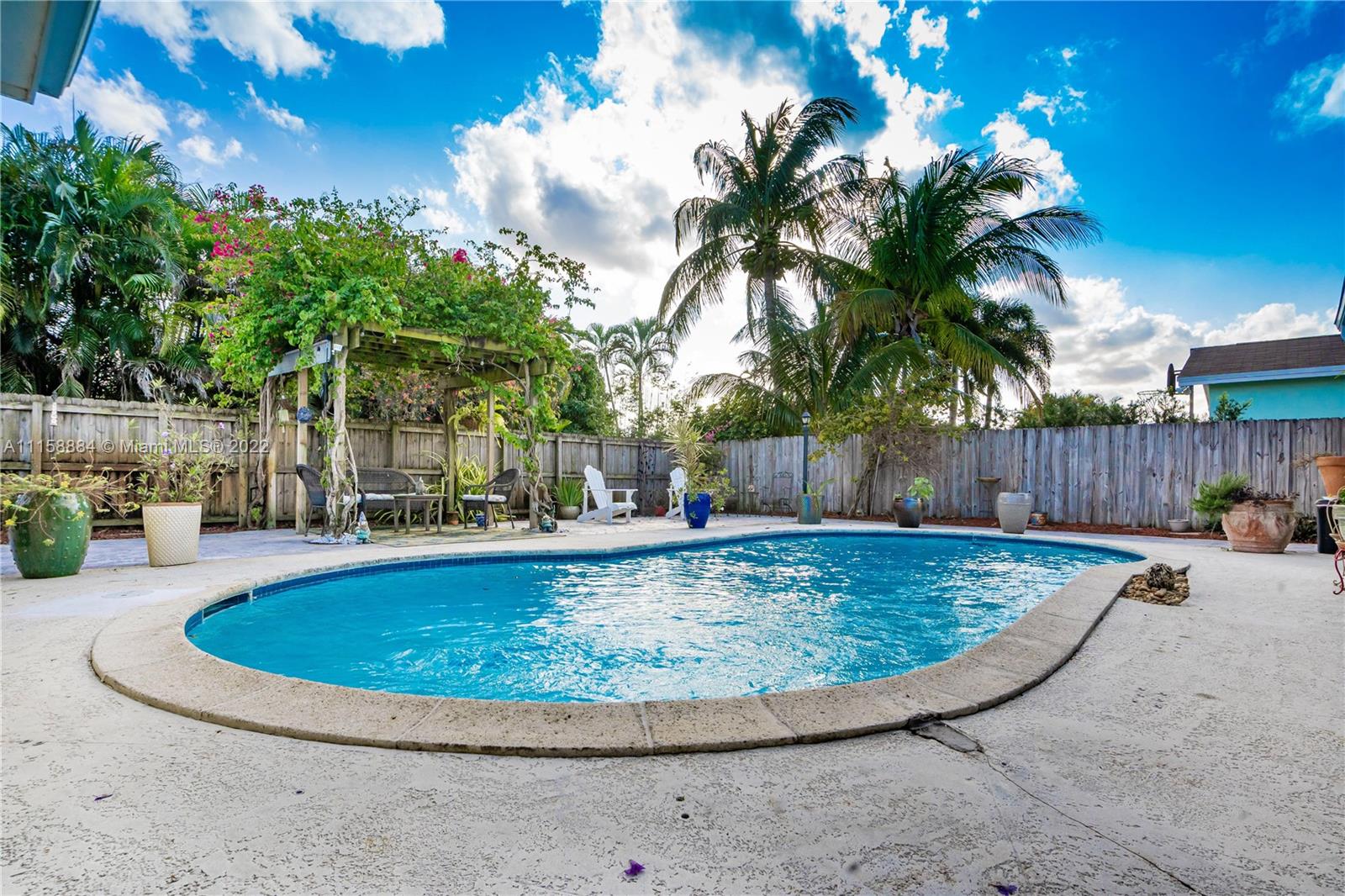 5012 Hayes Street Hollywood, FL 33021 - Photo 30 of 36 a view of a backyard with swimming pool