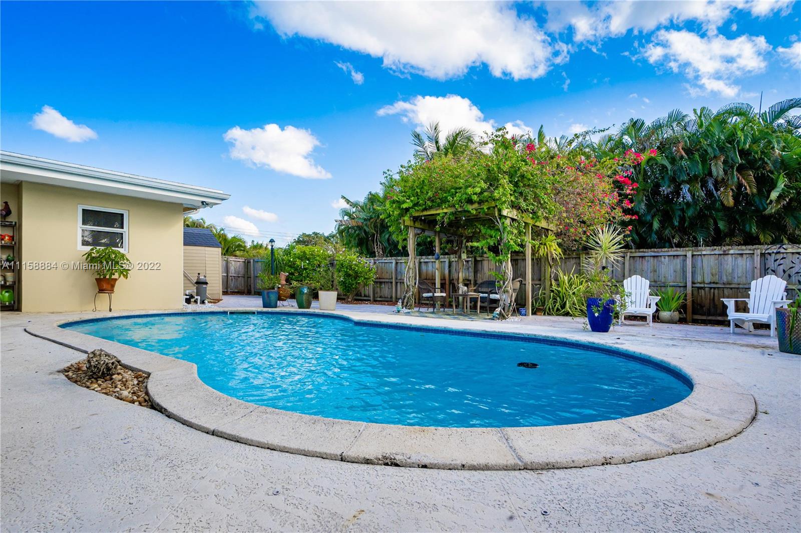 5012 Hayes Street Hollywood, FL 33021 - Photo 31 of 36 a view of a swimming pool with a patio