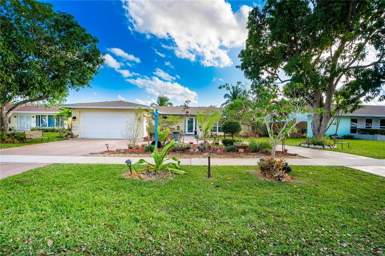 5012 Hayes Street Hollywood, FL 33021 - Photo 35 of 36 a view of a house with a backyard porch and sitting area