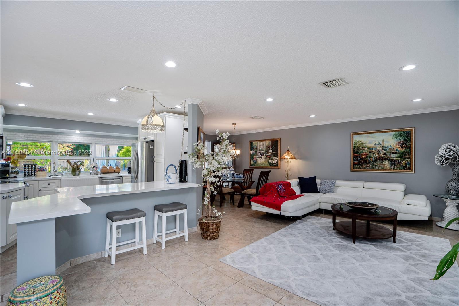 5012 Hayes Street Hollywood, FL 33021 - Photo 4 of 36 a living room with furniture and a large window
