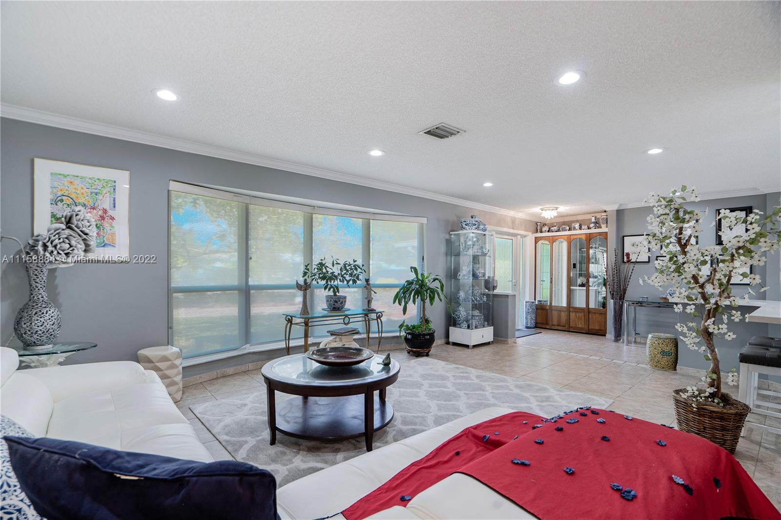 5012 Hayes Street Hollywood, FL 33021 - Photo 6 of 36 a living room with furniture and a large window