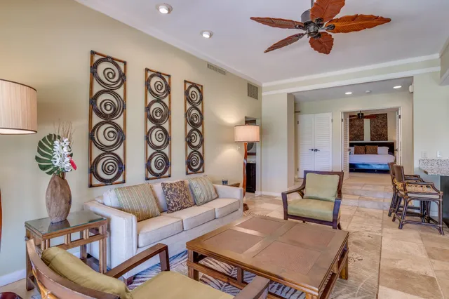 a living room with furniture and a rug