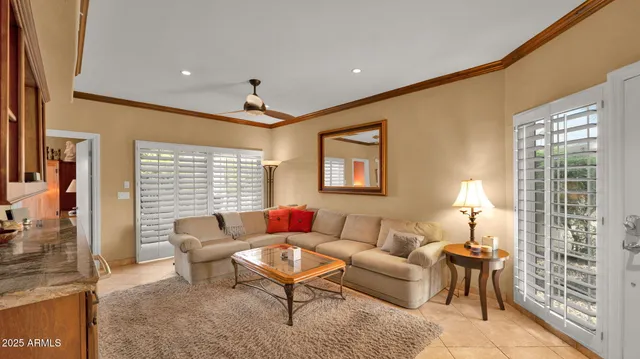 a living room with furniture and a lamp