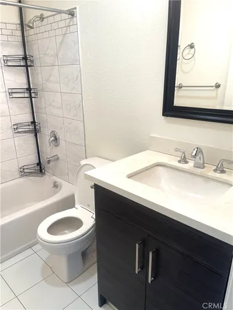 a bathroom with a sink a toilet and a bathtub
