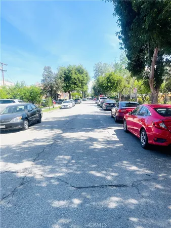 a view of a street with cars