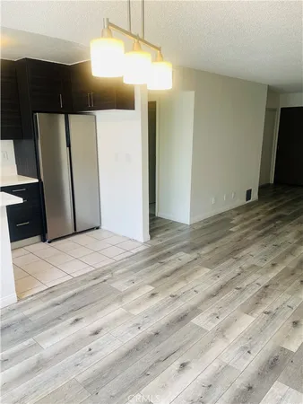 a view of a livingroom with wooden floor
