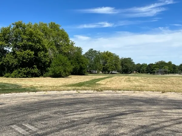 a view of a yard next to a lake