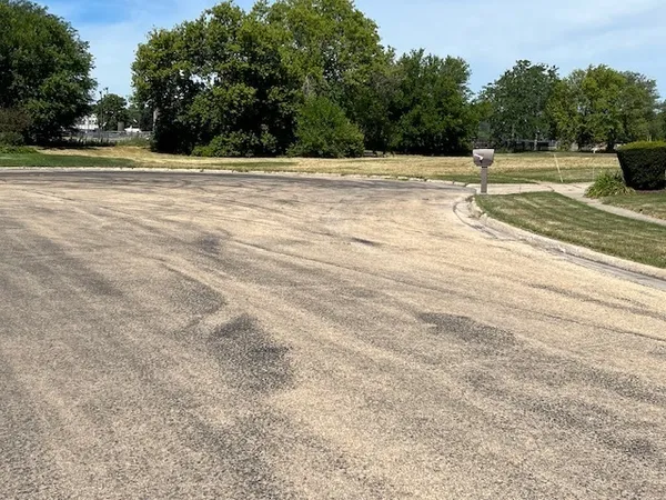 a view of a swimming pool with a yard