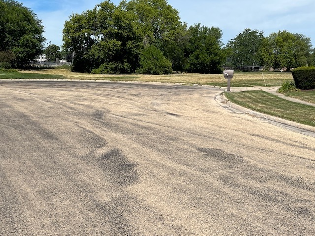 Lot 11 Kelley Drive Rochelle, IL 61068 - Photo 4 of 4 a view of a swimming pool with a yard