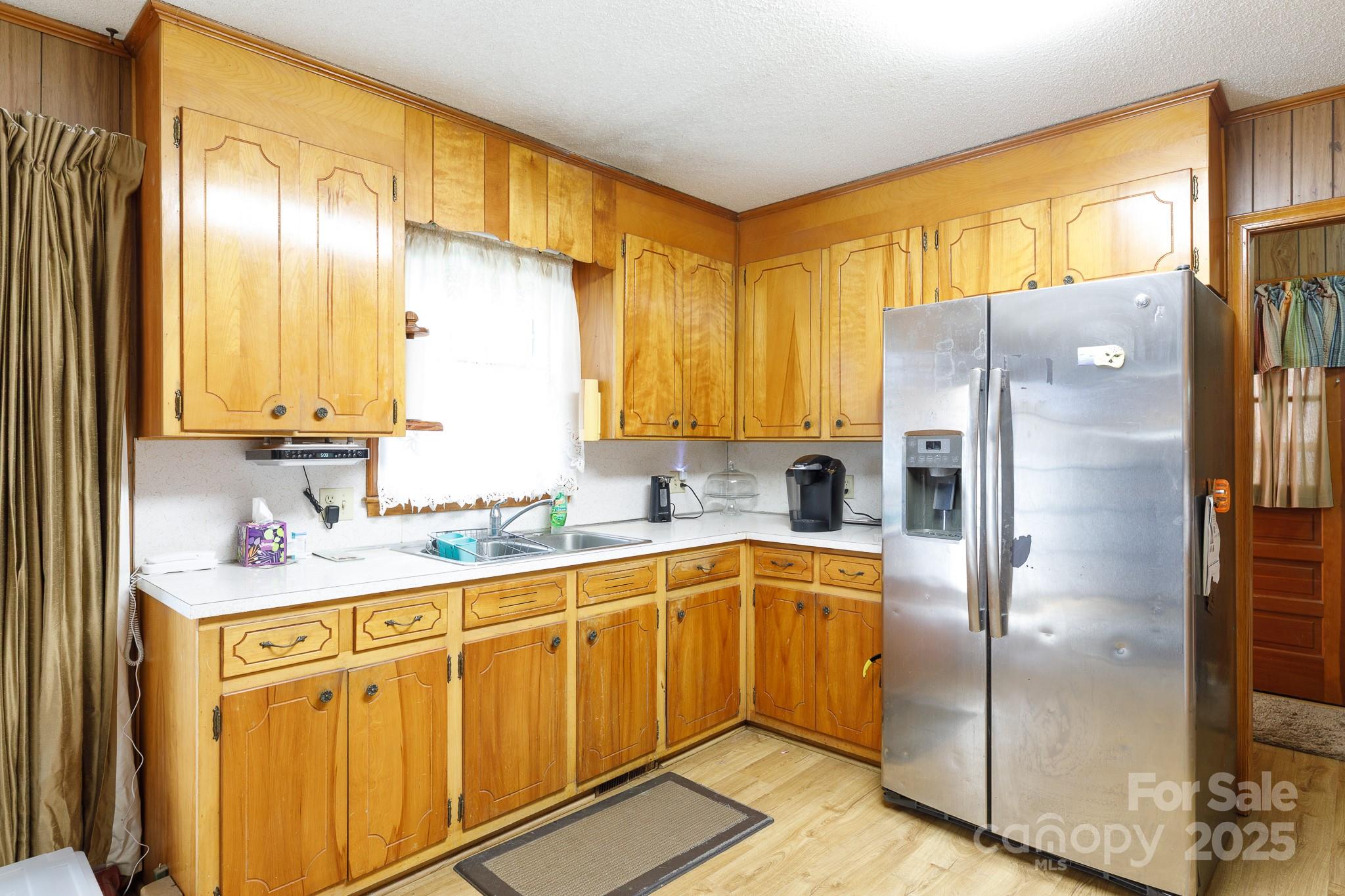 1626 Camp Creek Road Lancaster, SC 29720 - Photo 13 of 29 a kitchen with stainless steel appliances a refrigerator sink and cabinets
