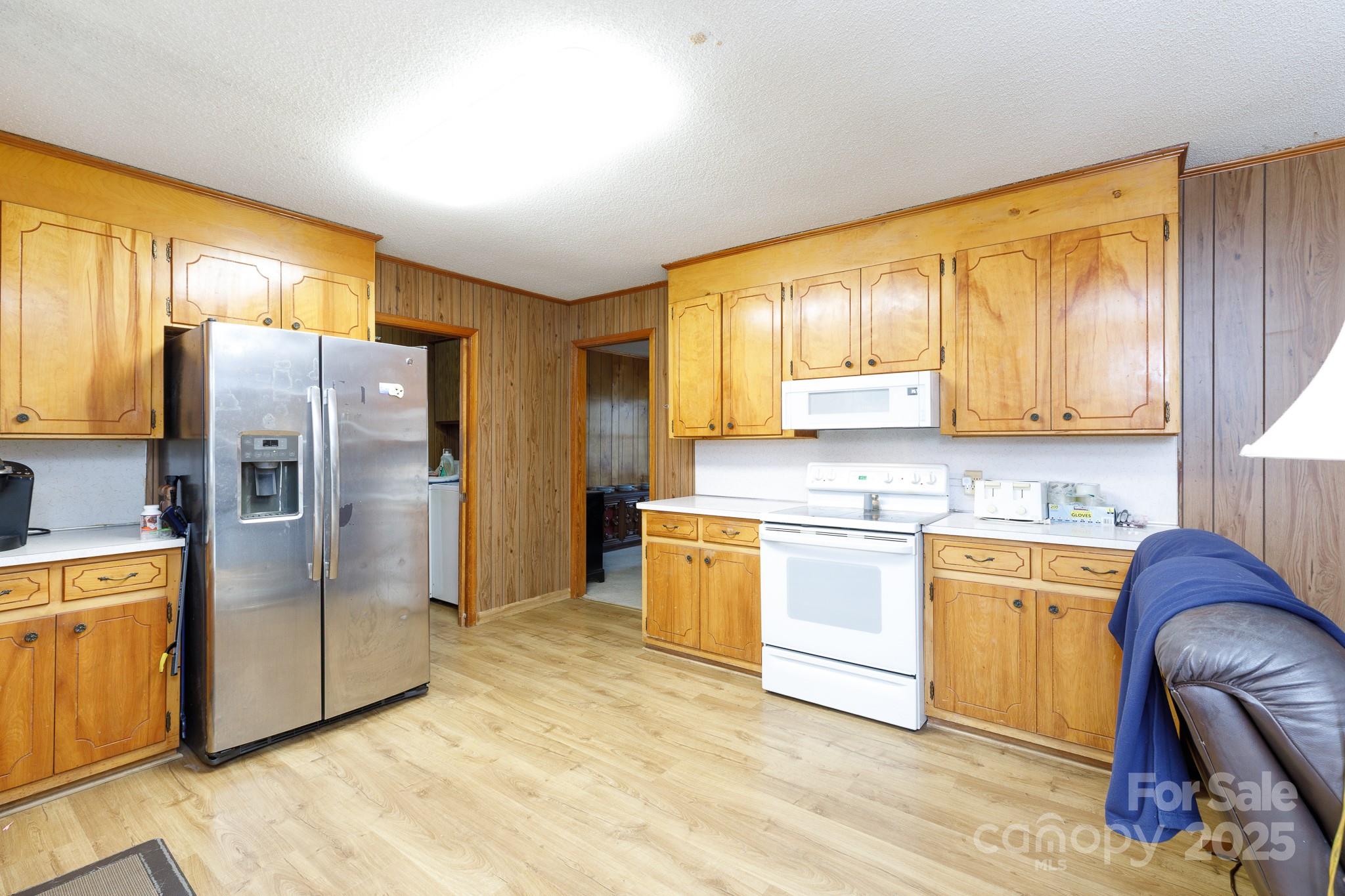 1626 Camp Creek Road Lancaster, SC 29720 - Photo 14 of 29 a kitchen with stainless steel appliances granite countertop a refrigerator a stove and a sink with cabinets