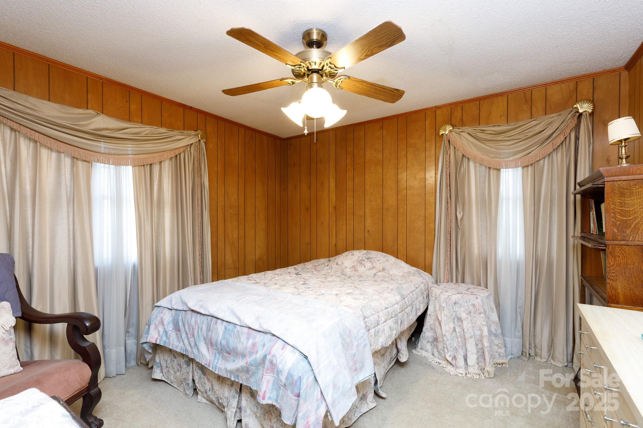 1626 Camp Creek Road Lancaster, SC 29720 - Photo 15 of 29 a bedroom with a bed and a chandelier