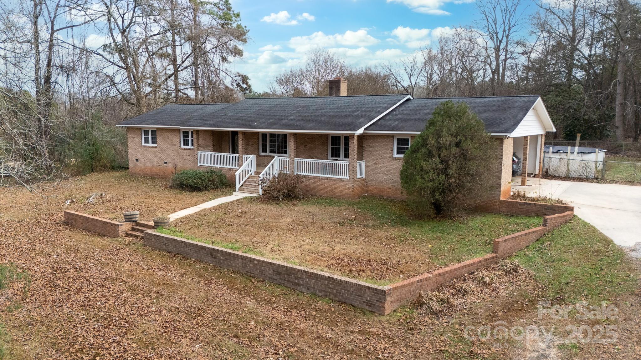 1626 Camp Creek Road Lancaster, SC 29720 - Photo 2 of 29 a front view of a house with garden