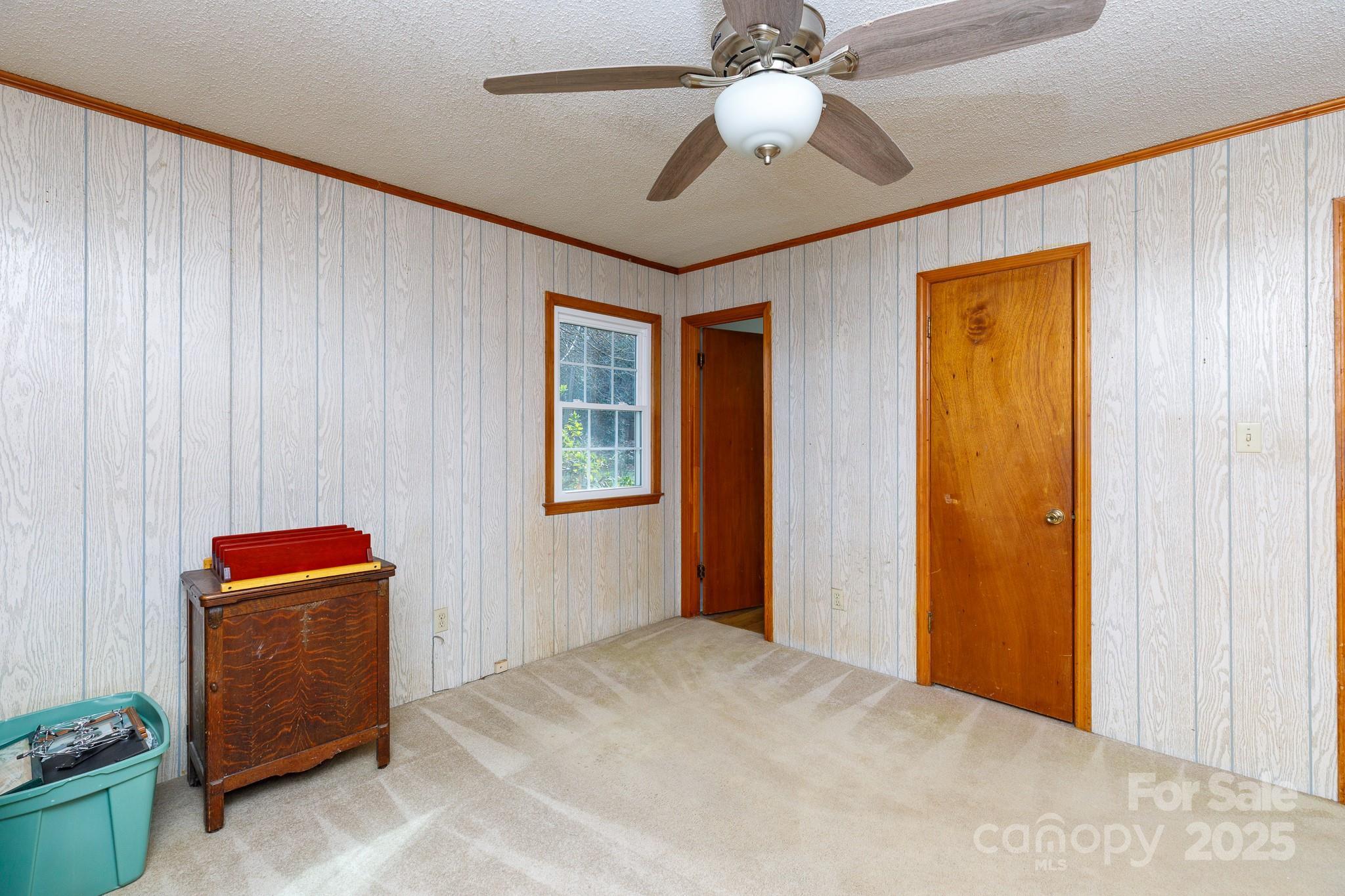 1626 Camp Creek Road Lancaster, SC 29720 - Photo 22 of 29 a bedroom with a bed and a chandelier