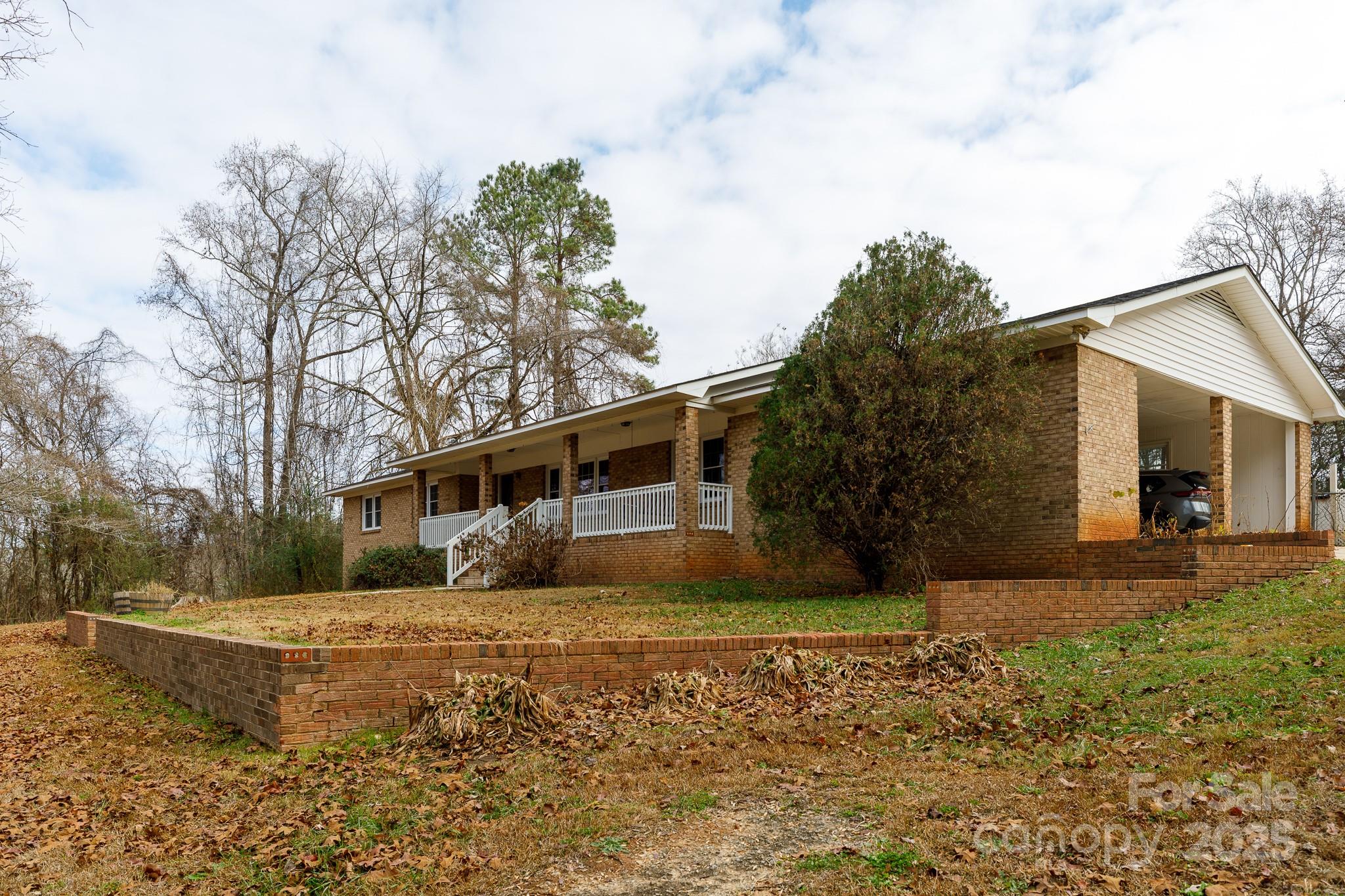 1626 Camp Creek Road Lancaster, SC 29720 - Photo 3 of 29 a house that has a tree in front of it